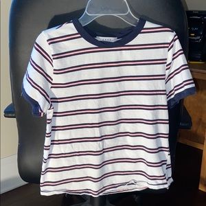 A white crop top with navy blue and red stripes